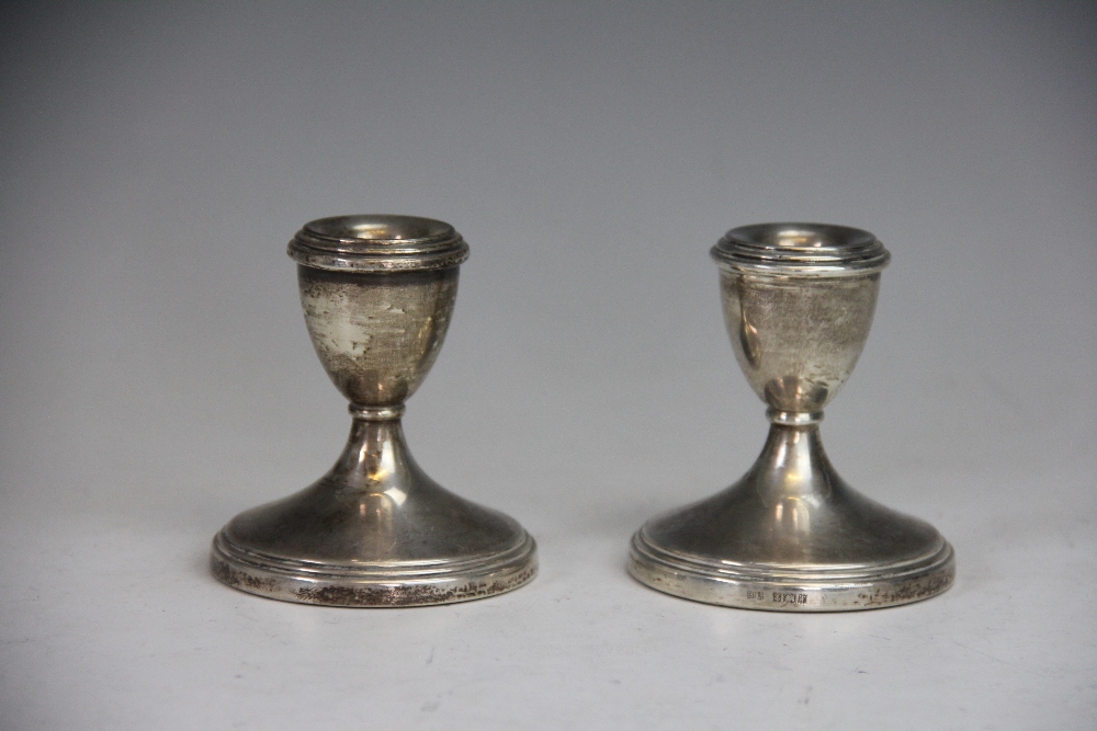 A pair of silver short candlesticks, Bishton's Ltd, Birmingham 1971, each of typical form,