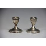 A pair of silver short candlesticks, Bishton's Ltd, Birmingham 1971, each of typical form,