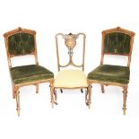 A pair of Victorian walnut chairs, with green upholstery, on turned legs,