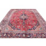 A large Persian hand woven wool carpet,