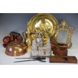 A collection of metal wares to include a gilt metal rococo style frame, a copper charger, kettles,