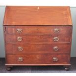 A George III mahogany bureau, with fall enclosing a fitted interior,