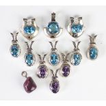 A selection of eleven topaz and amethyst set pendants, all set in white metal stamped '925',