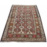 A Persian hand woven wool rug,