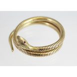 A 9ct yellow gold snake bangle, Cropp and Farr, Birmingham 1982, the articulated,