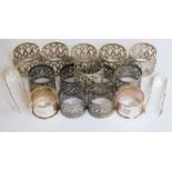 A collection of fourteen assorted white metal napkin rings,