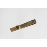 A yellow metal tie slide stamped 'Tiffany & Co 14K', with textured finish, weight 5.3gms, 4.