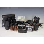 An assortment of vintage cameras to include a Kodak Retinette camera, Pentax, Ricoh,