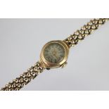 A 9ct yellow gold lady's wristwatch, the circular dial with 12 and 6 and batons,