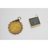 An Edward VII gold half sovereign dated 1902 within pendant mount, weight 4.