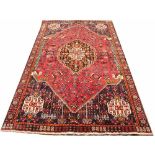 A Caucasian hand woven wool carpet, worked with an all over foliate design,