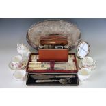 An assortment of silver plated wares to include an oval gallery tray, a cased carving set,