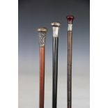 Three silver handles walking canes, comprising a bamboo cane with silver collar, London 1925,