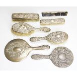 A collection of assorted silver backed dressing table brushes, to include; two hand mirrors,