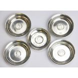 A set of four silver dishes, Edinburgh 1937, each inset with a coin, 7.