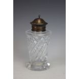 A silver topped sugar caster, London 1936, with conical cut glass body and simple silver cover,