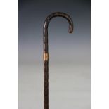 A Brigg 9ct gold mounted bamboo walking cane, London 1900, makers initials C.
