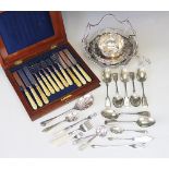 A set of twelve pairs of plated knives and forks, with spiral carved ivory handles,