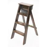 A vintage stained pine step ladders,