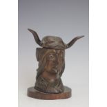 A desk inkwell in the form of a native American Indian,