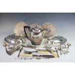 A selection of silver plated wares, to include; flatware, a hot water pot, entree dishes,