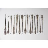 A collection of fifteen silver handled button hooks, Victorian and later,