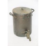 A 19th century copper and brass large pressure cooker, with loop handles and large tap at base,