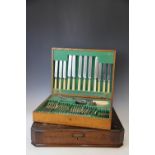 An oak cased canteen containing a set of Old English pattern silver plated cutlery for six,