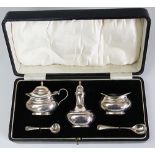 A cased silver condiment set, Kimberley and Hewett, Birmingham 1928, each of low oval form,