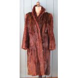 A vintage musquash fur coat and a selection of under-garments,