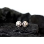 A pair of diamond cluster stud earrings,