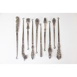 A collection of ten silver handled button hooks, Victorian and later,