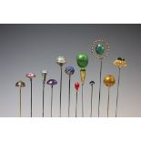 A collection of twelve assorted stone set hat pins,