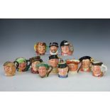 Twelve Royal Doulton small character jugs; Golfer D6756, Sam Weller, Sairey Gamp,