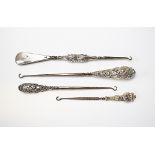 A selection of three silver handled button hooks, to include; Crisford and Norris, Birmingham 1904,