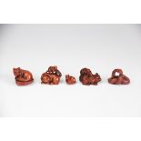 Five assorted netsuke, early 20th century, to include; four cat examples and a snake,