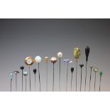 A collection of eighteen assorted hat pins, to include, enamelled ladies, jewelled examples,