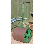 A late 19th century cast iron lawn roller, with open sides,