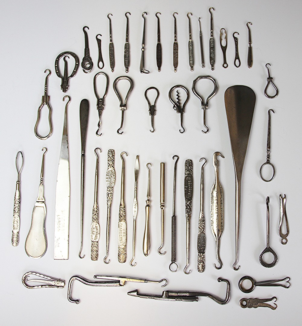 A collection of advertising button and glove hooks, to include; Johnson Johnson & Co's Pure Tea,