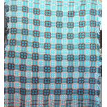 A Welsh wool blanket, worked in geometric patterns in turquoise, orange and white,