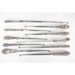 A collection of ten silver handled long button hooks, Victorian and later,