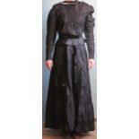 A late Victorian black silk and taffeta dress, comprising lace lined top and skirt,