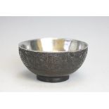 A Chinese silver and coconut mounted bowl, the exterior carved with symbols,