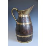 A coopered cider jug or stick stand, with brass bound spout and handle,