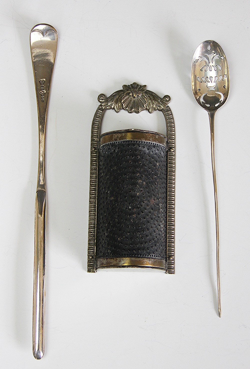 A silver mote spoon, marks illegible, with foliate pierced bowl and tapering handle, 15cm long,