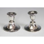 A pair of silver short candlesticks, E F Braham Ltd, Birmingham 1909,