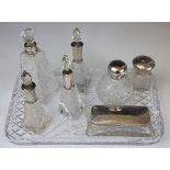 A selection of silver topped dressing table jars,