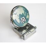 An Art Deco desk calendar, designed as a globe with perpetual month/date/day apertures, 7.