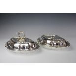 A pair of silver plated entree dishes, each of lobed and cusped form,