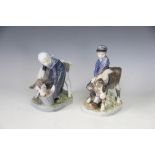 Two Royal Copenhagen figures of a boy and calf number 772 and a girl and calf number 779,